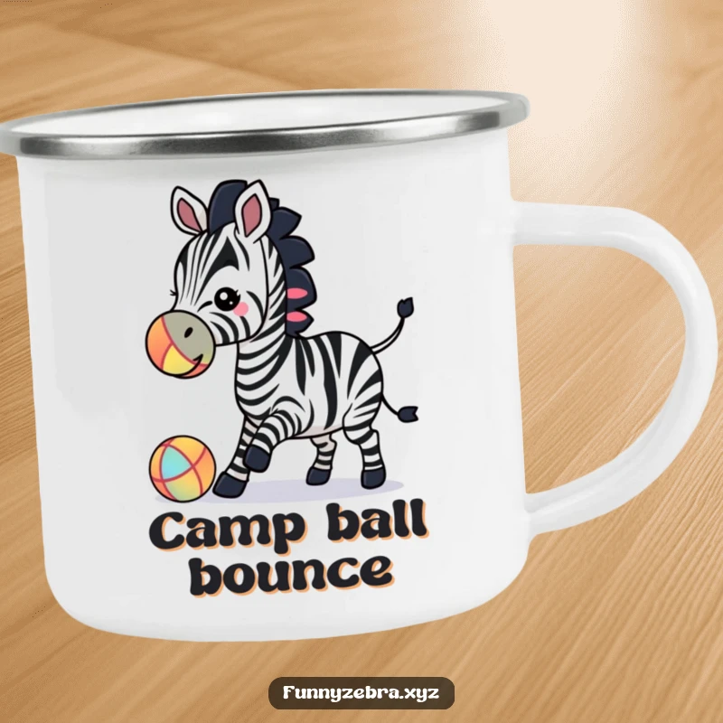 Enamel camping mug featuring a funny zebra silhouette playfully nudging a colorful ball with its nose, perfect for outdoor drinks.